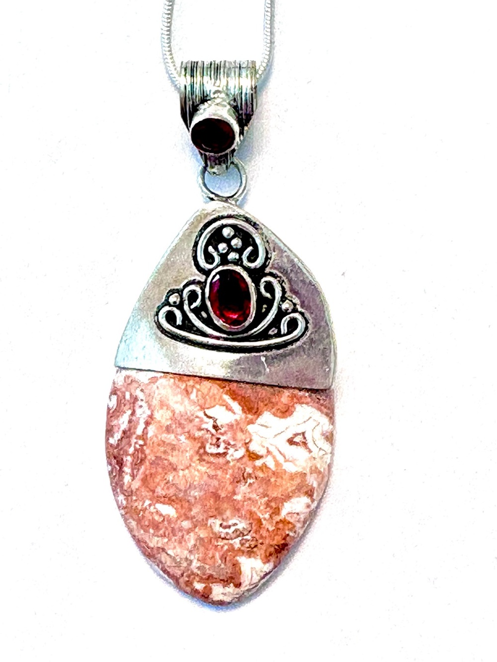 Beautiful,2 1/2 inch, Crazy Lace Agate and garnet pendant on a silver chain.